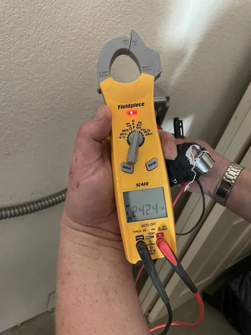 Voltage testing with clamp meter during Electrical Installation Services in Bella Vista